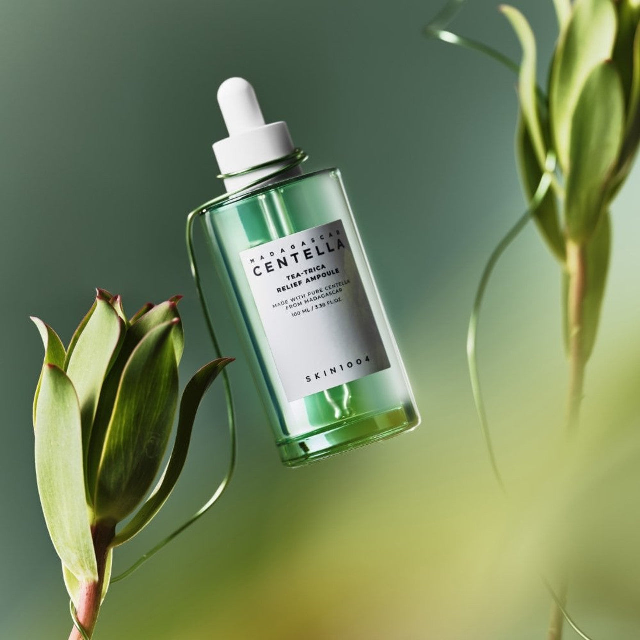 SKIN1004 Madagascar Centella Tea-trica Relief Ampoule 100ml glowing amongst greenery
