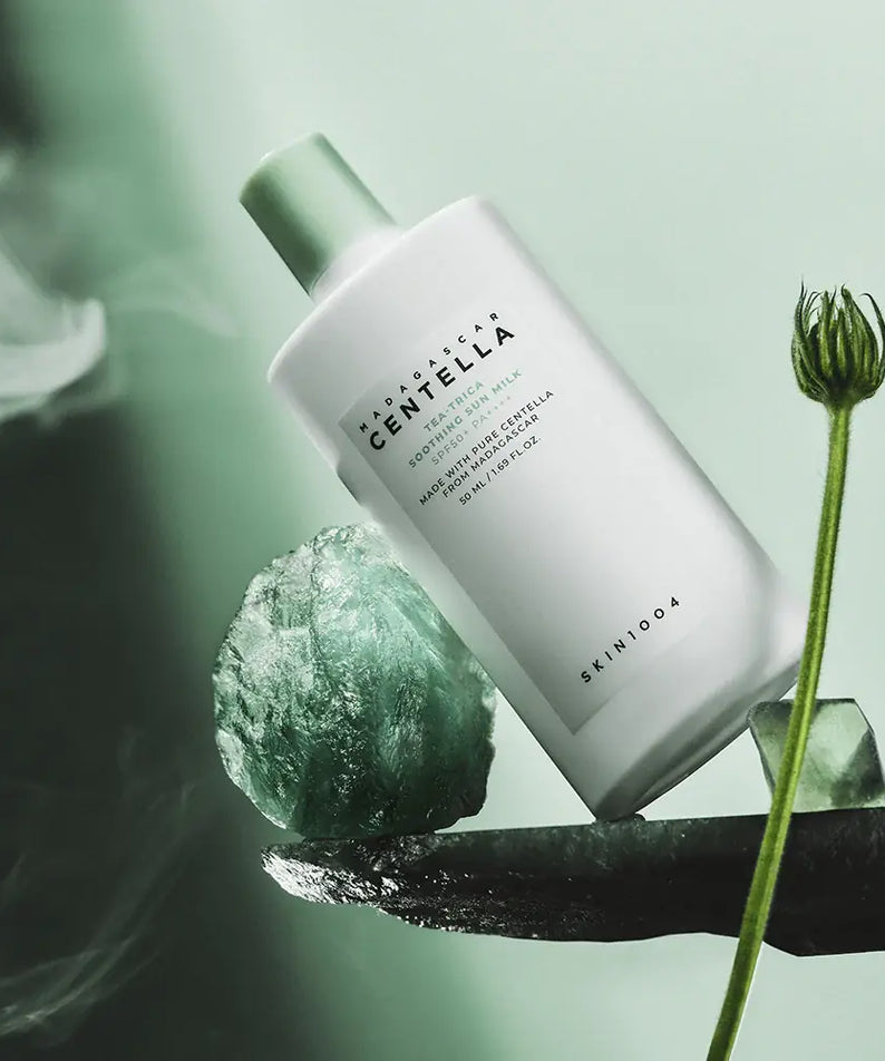 SKIN1004 Madagascar Centella Tea-trica Soothing Sun Milk 50ml product on display with natural elements