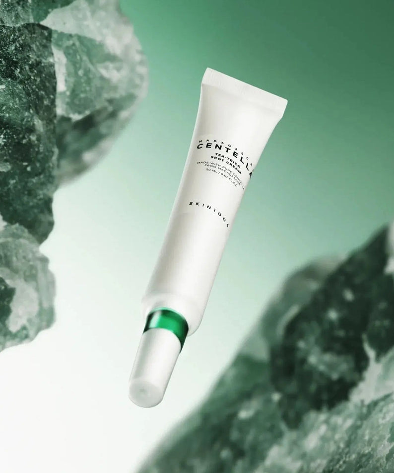 SKIN1004 Madagascar Centella Tea-trica Spot Cream 20ml tube on a green background with stones