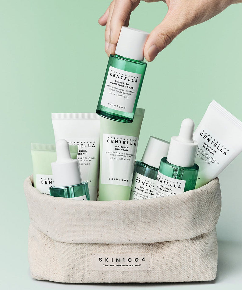 SKIN1004 Madagascar Centella Teatrica Travel Kit products in a pouch with green background