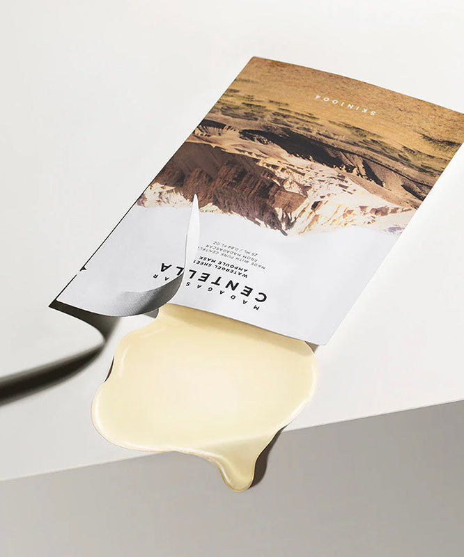 SKIN1004 Madagascar Centella Water Gel Sheet Ampoule Mask 25ml [5 sheets] on a white background with gel leaking from the package.