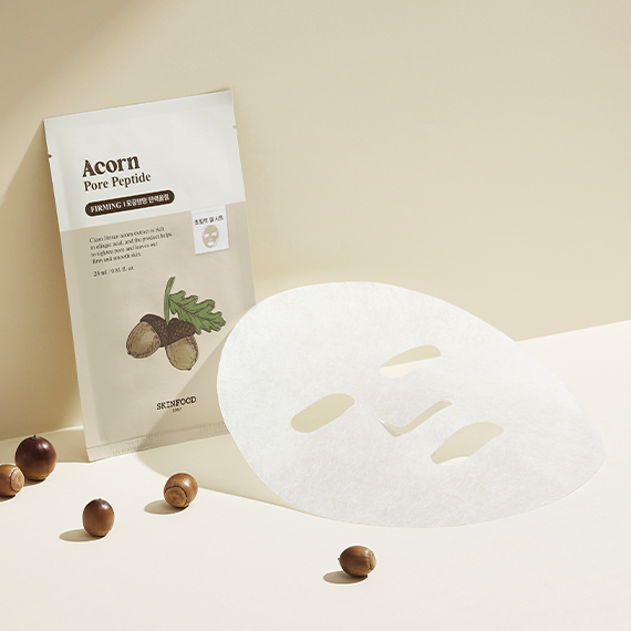 SKINFOOD Acorn Pore Peptide Firming Mask with mask sheet and acorns, for skincare and pore firming benefits.