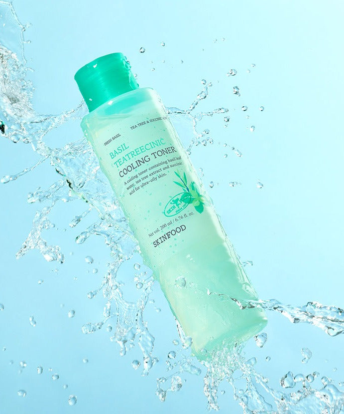 SKINFOOD Basil Tea Tree Cynic Cooling Toner 200ml bottle with water splash, refreshing skincare product for oily and acne-prone skin.