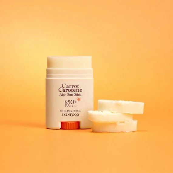 SKINFOOD Carrot Airy Soft Sun Stick 18.5g with SPF 50 on orange background