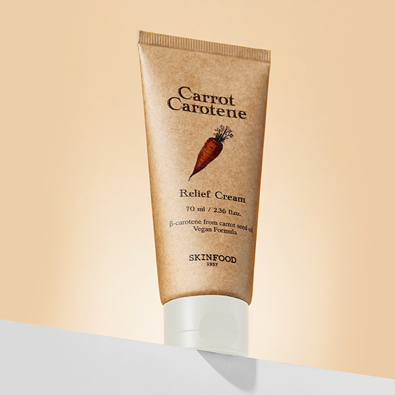 SKINFOOD Carrot Carotene Relief Cream 70ml tube on a gradient background