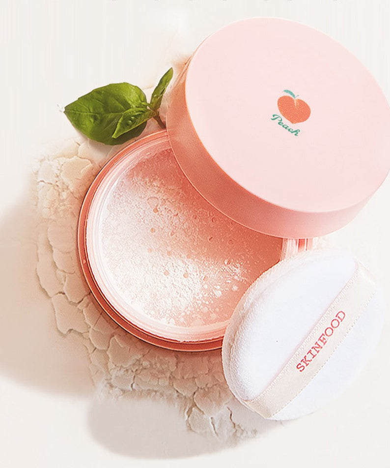 SKINFOOD Peach Cotton Multi Finish Powder in an open peach-colored container with applicator pad, showing the finely milled powder texture.