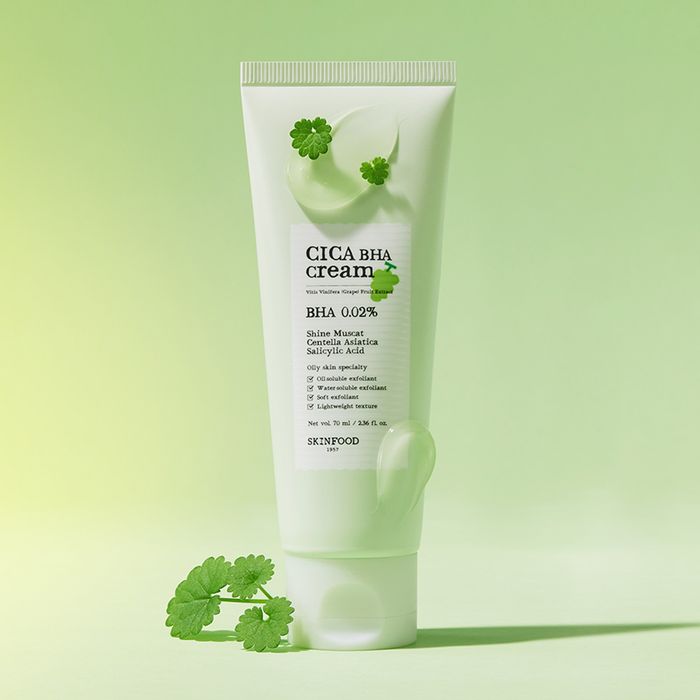 SKINFOOD Shine Muscat Cica Baja Cream 70ml tube with green leaves on a green background