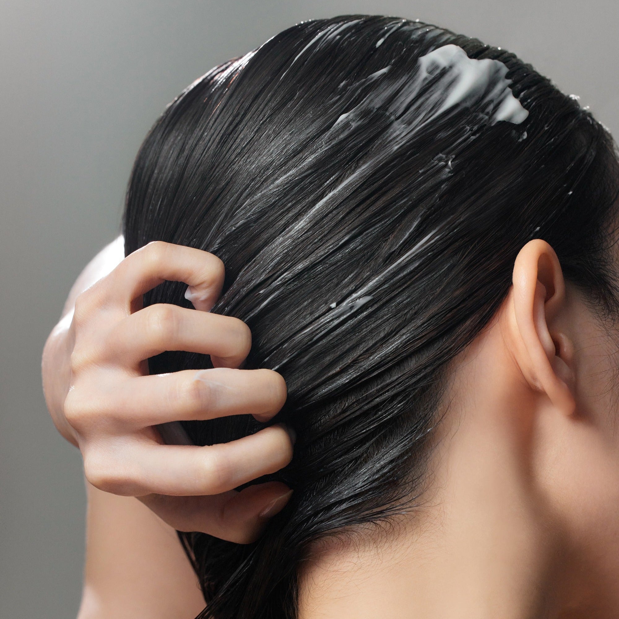 Application of SOME BY MI Cica Peptide Anti Hair Loss Derma Scalp Treatment 50ml for healthy scalp and hair care.