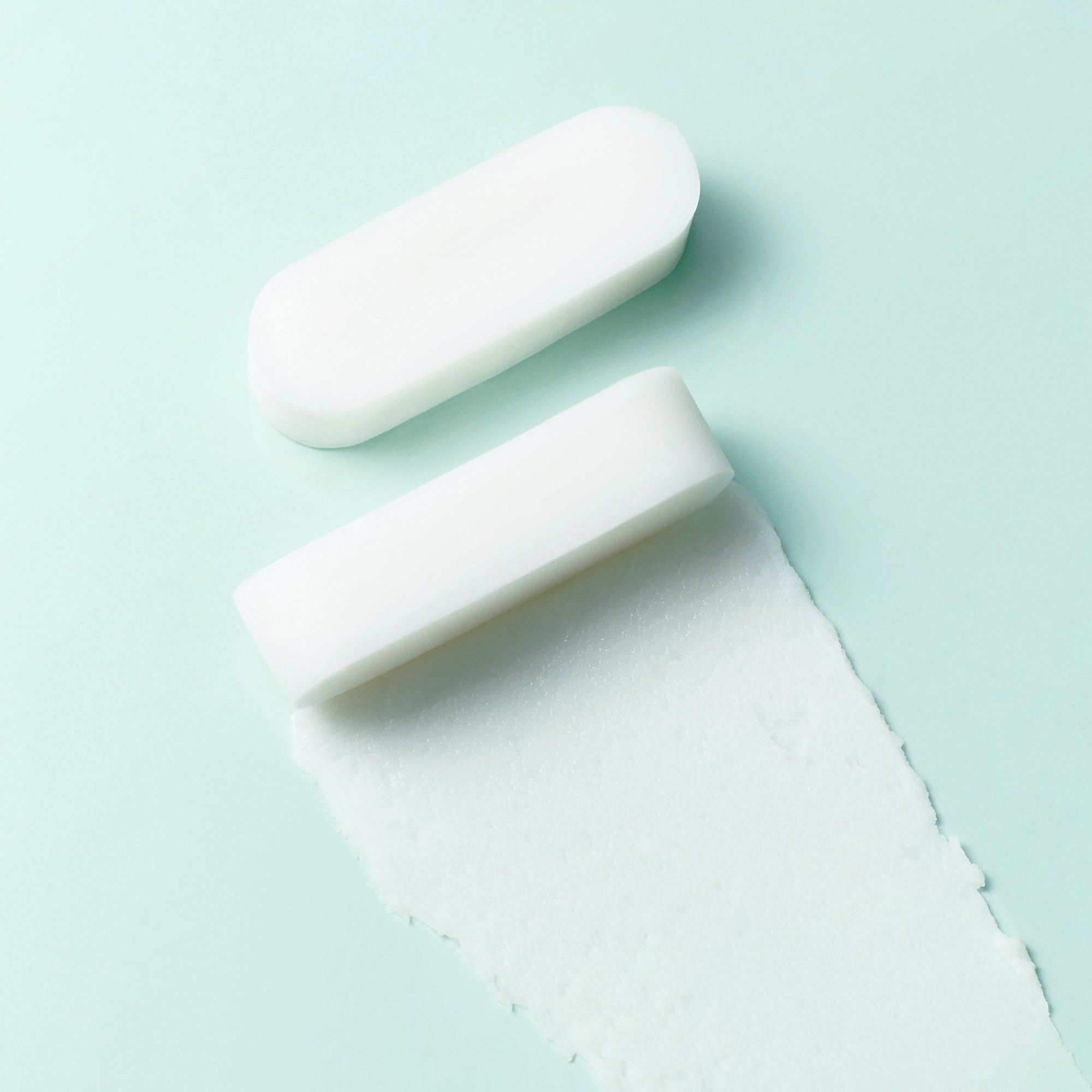 White solid bar with texture on a light green background