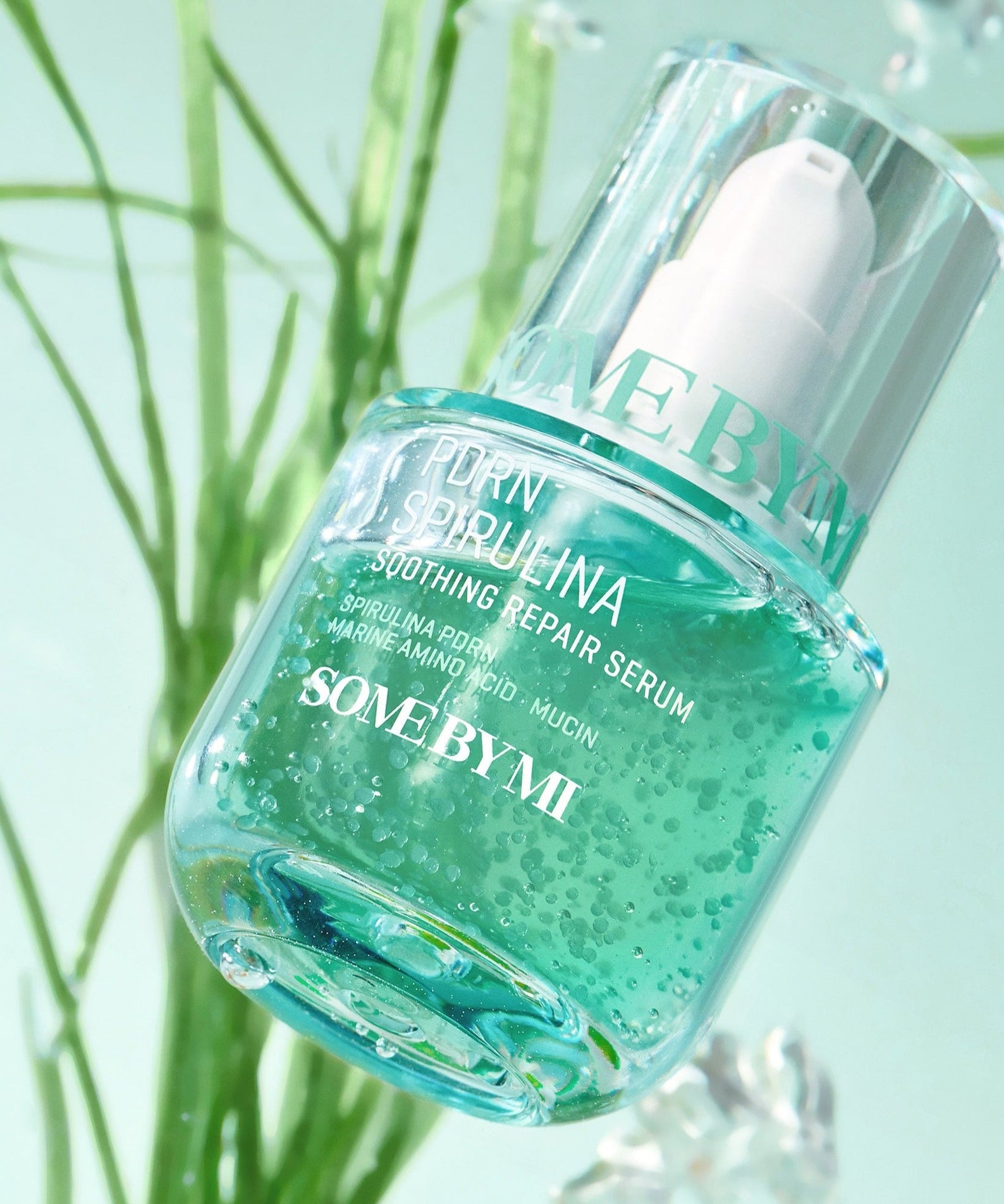SOME BY MI PDRN Spirulina Soothing Repair Serum 50ml bottle against a nature-inspired background