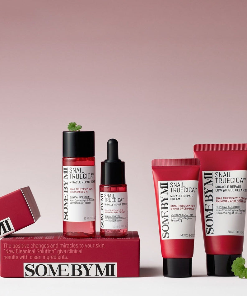 SOME BY MI Snail True Cica Miracle Repair Starter Kit (Cleanser+Toner+Serum+Cream) displayed on a pink background.