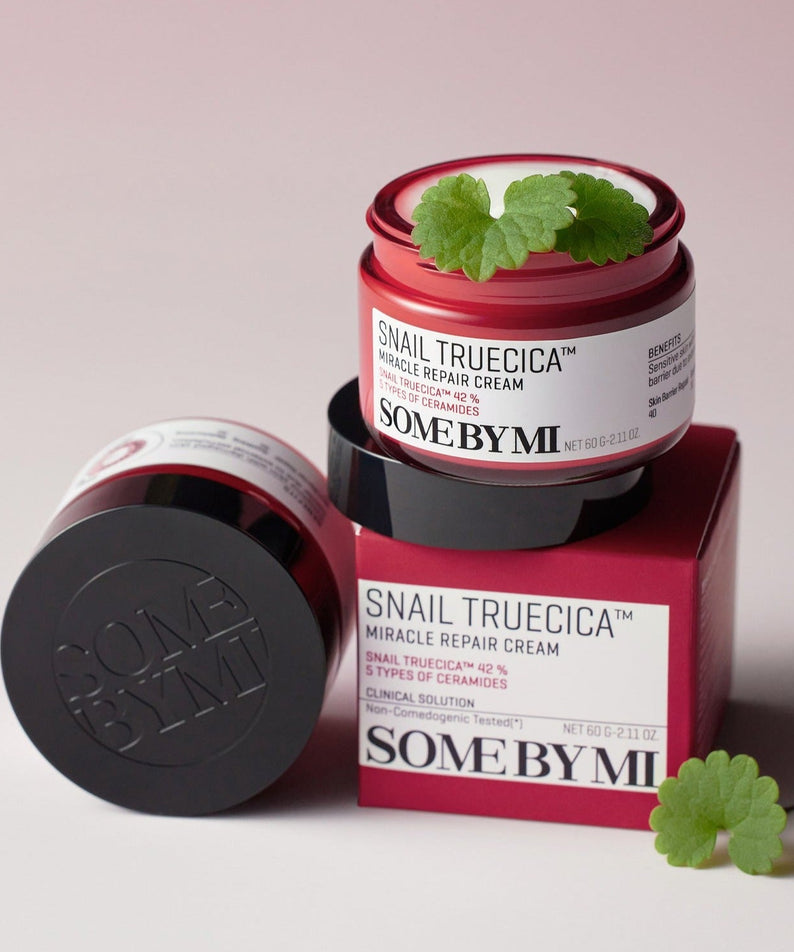 SOME BY MI Snail Truecica Miracle Repair Cream 60g open jar on red box with plant leaves, enhancing skin rejuvenation and repair.