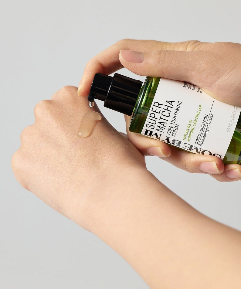 Applying SOME BY MI Super Matcha Pore Tightening Serum 50ml on hand