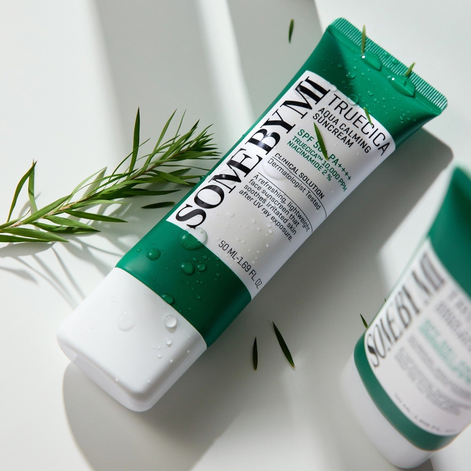 SOME BY MI Truecica Aqua Calming Sun Cream 50ml tube on white background with green accents