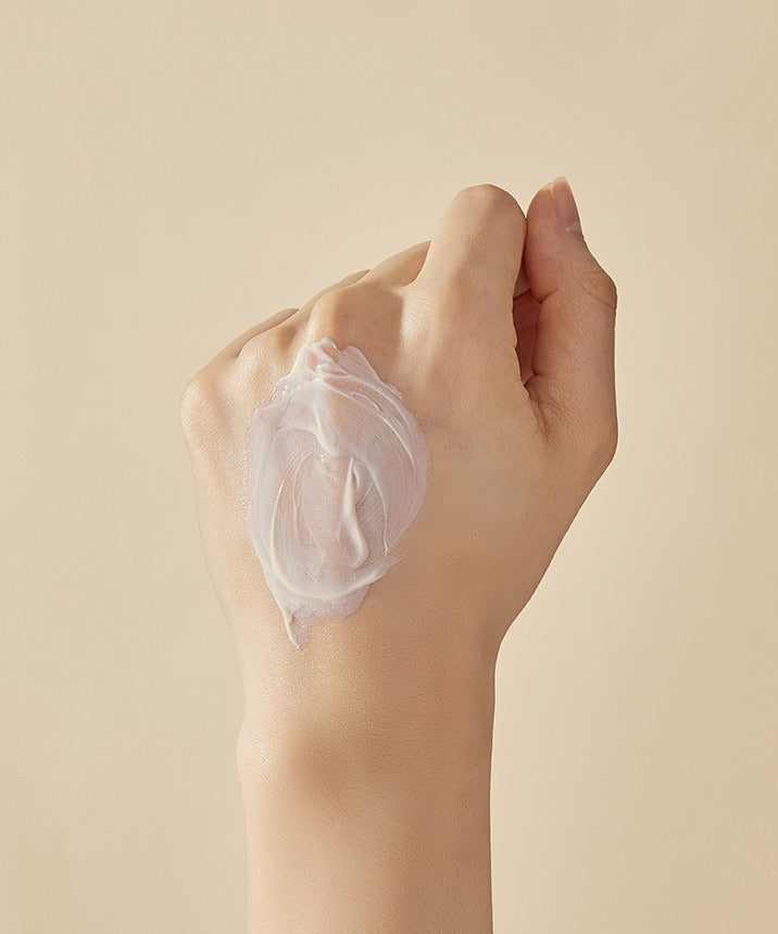 SOORYEHAN Hyobidam Fermented Sunscreen 60ml texture on hand, showcasing creamy consistency and smooth application on skin.