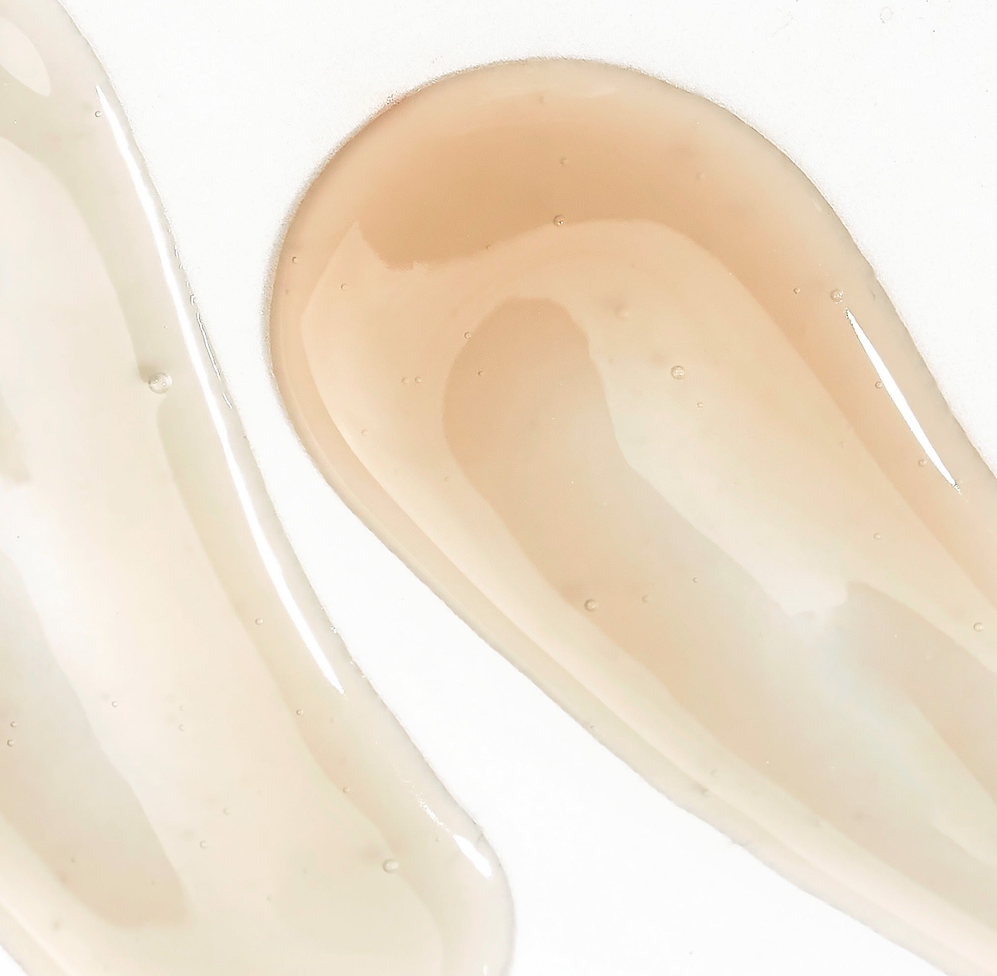 Texture of SOORYEHAN The Black Serum 30ml showing two serum swatches on a white background