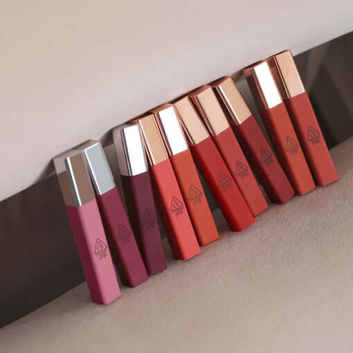 Assorted shades of STYLE NANDA 3CE Cloud Lip Tint displayed on a neutral background.