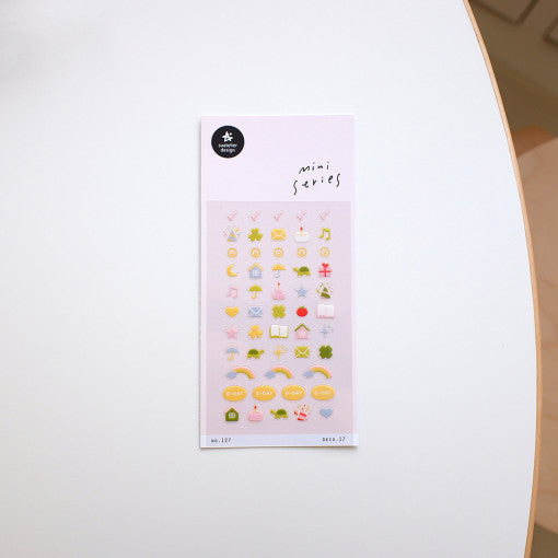 SUATELIER Deco.17 Stickers on white surface showcasing colorful icons for creative decoration and art projects.