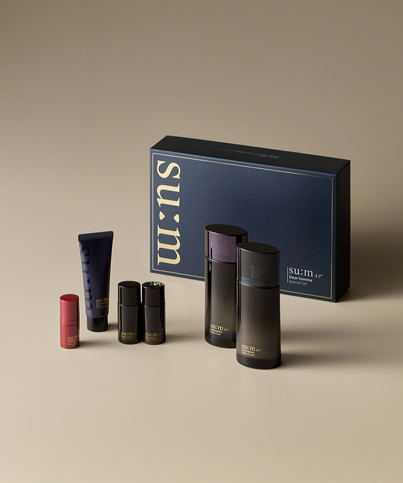 SU:M37 Dear Homme Basic 2-piece set displayed with navy gift box and skincare bottles, Gentleman Korea premium Korean men’s grooming set