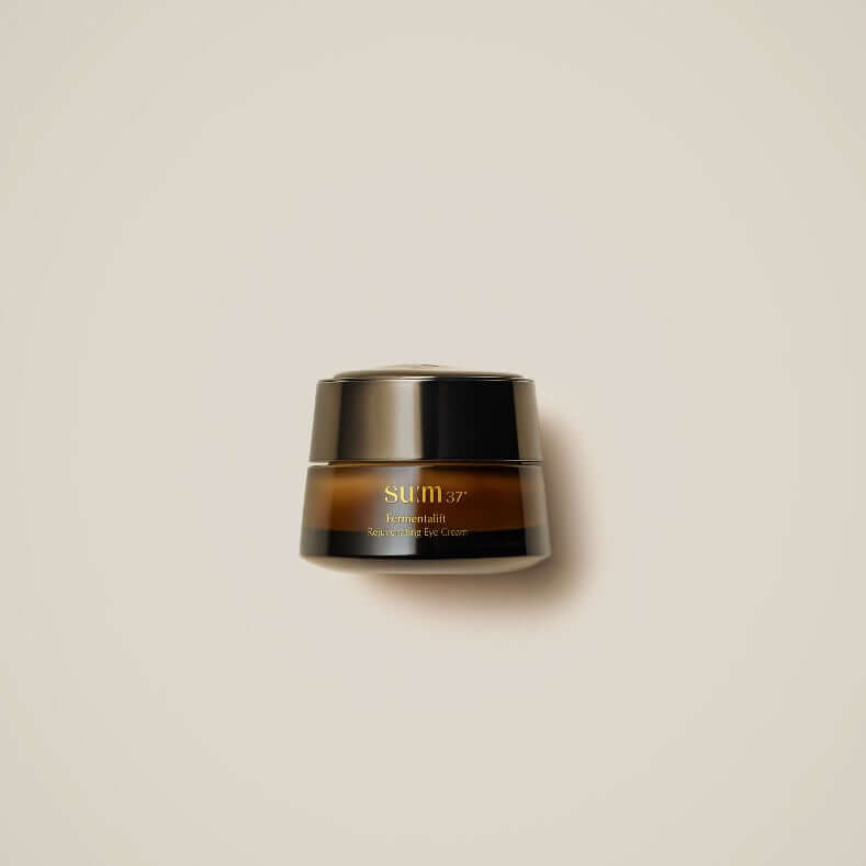 Image of SU:M37 Fermentalift Rejuvenating Eye Cream 25ml container with minimalist design on a light background.