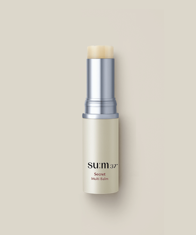 SU:M37 Secret Multi Balm 7g displayed on a beige background, highlighting its sleek design and compact size.