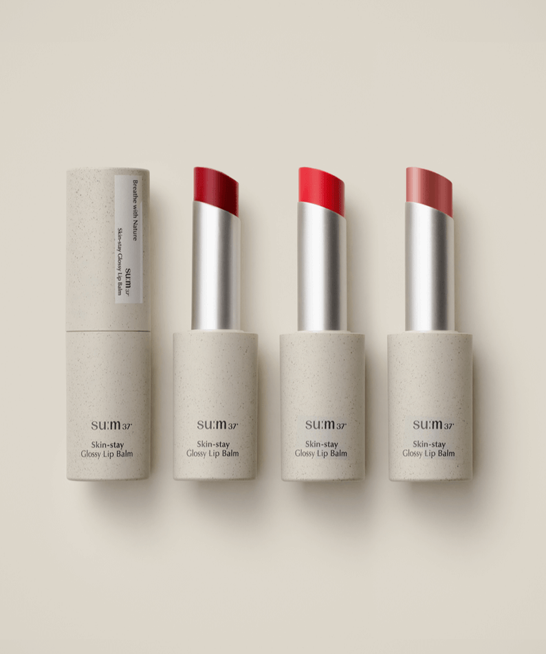 SU:M37 Skin-Stay Glossy Lip Balm featuring three shades of glossy finish lip balms with sleek packaging.