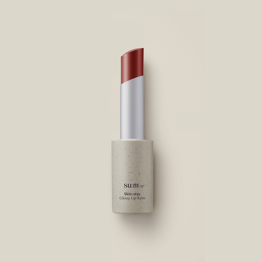 SU:M37 Skin-Stay Glossy Lip Balm in a sleek tube, offering a hydrating and shiny finish for lips.