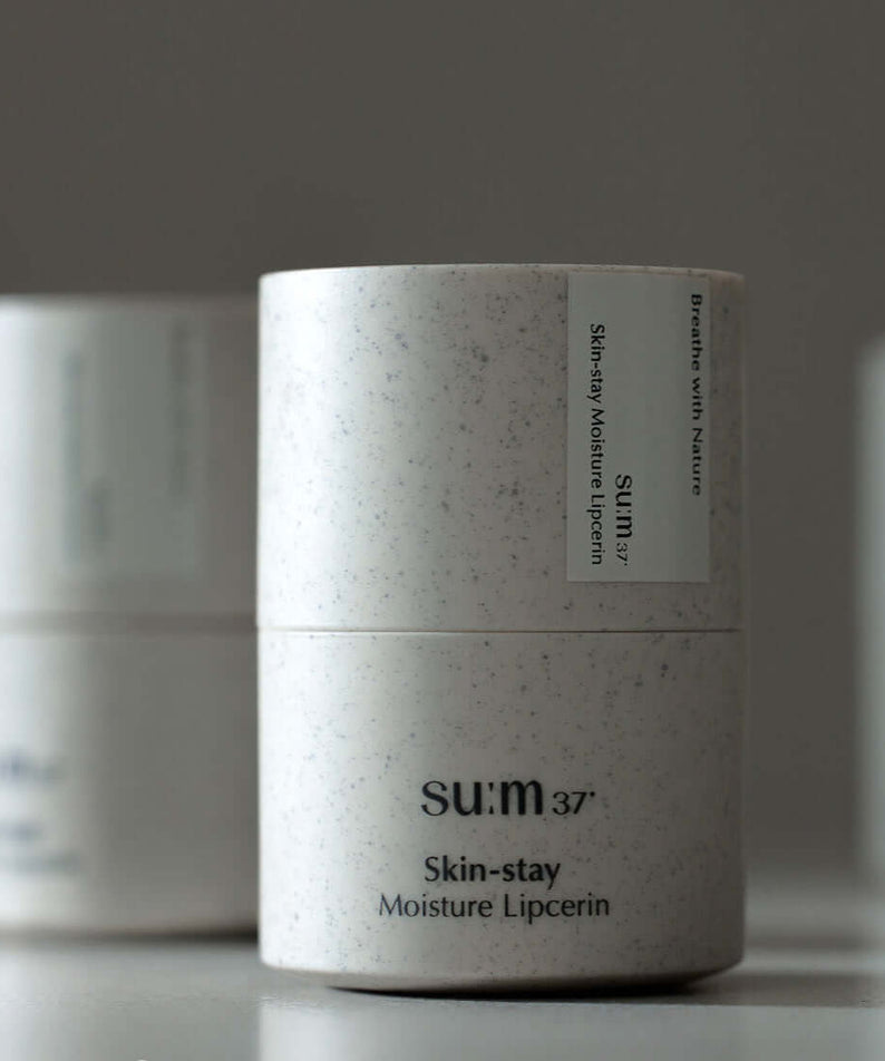 SU:M37 Skin-Stay Moisture Lip Serine 15ml container showcasing the product packaging.