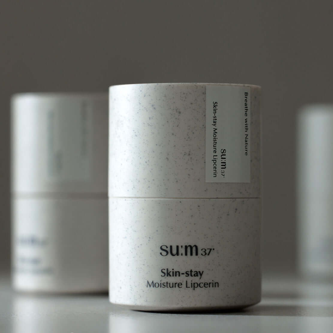 SU:M37 Skin-Stay Moisture Lip Serine 15ml container showcasing the product packaging.