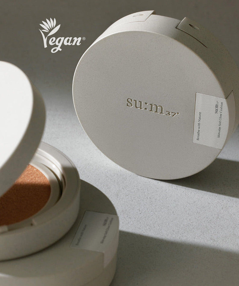 SU:M37 Skin-Stay Soft Glow Cushion compact with vegan logo, highlighting luxurious skincare and beauty product packaging.