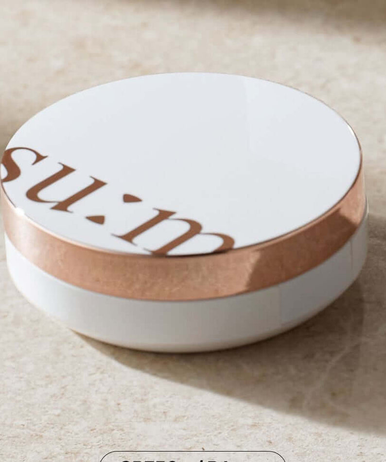 SU:M37 Sun-Away Cooling Sun CC EX product packaging on a marble surface