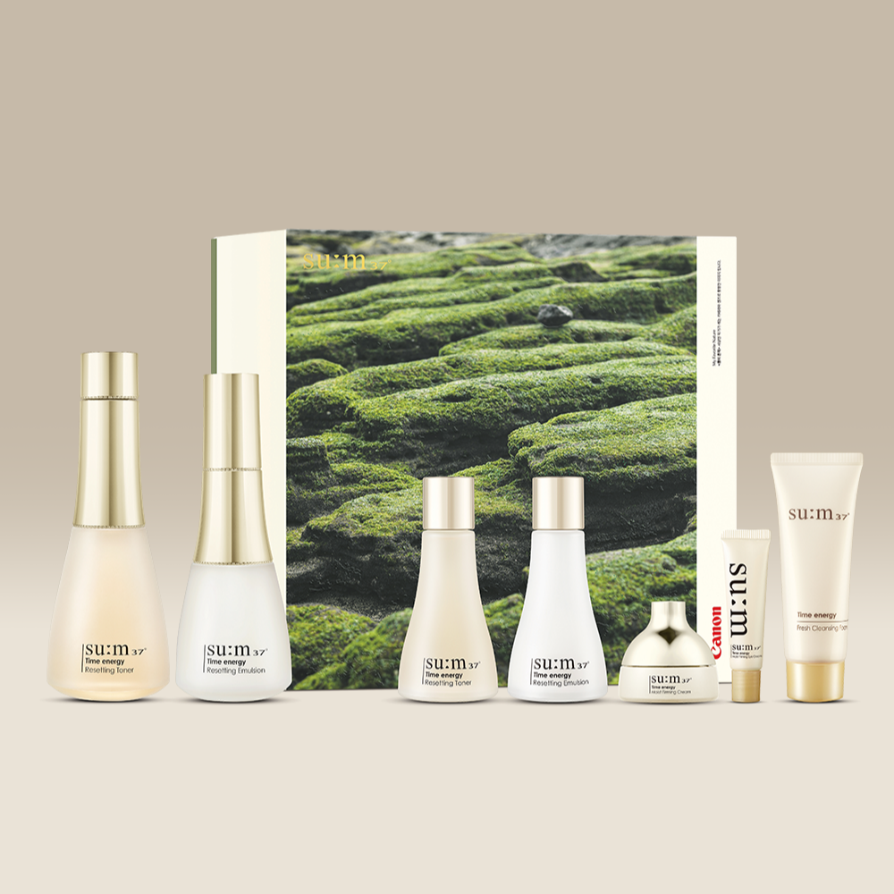 SU:M37 Time Energy 2-type plan (with Canon collaboration) skincare set in front of product box with moss design background.