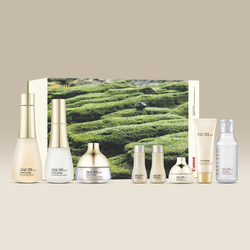 SU:M37 Time Energy 3-type plan (with Canon collaboration) product set with various skincare bottles and packaging.