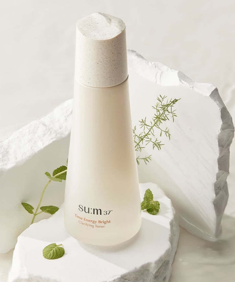 SU:M37 Time Energy Bright Clarifying Toner 170ml bottle with natural herbs on white background