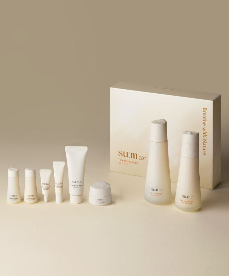 SU:M37 Time Energy Bright Foundation 2-piece set including skincare products and packaging on a neutral background.