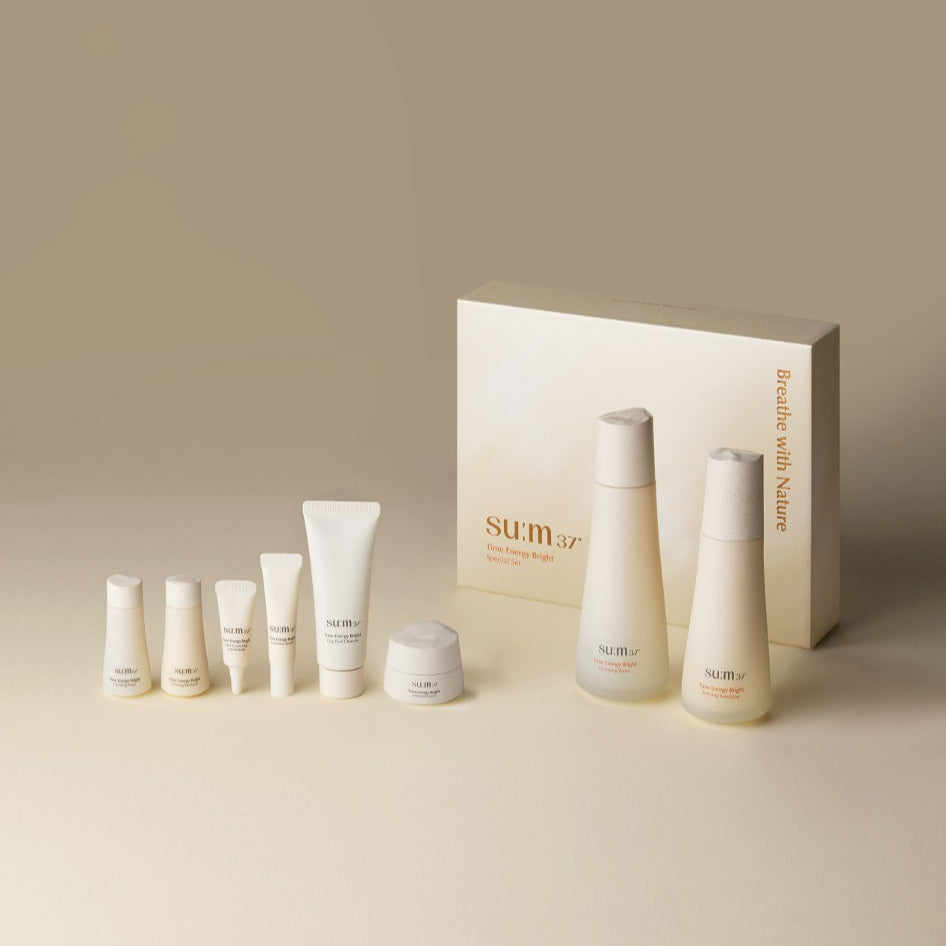 SU:M37 Time Energy Bright Foundation 2-piece set including skincare products and packaging on a neutral background.