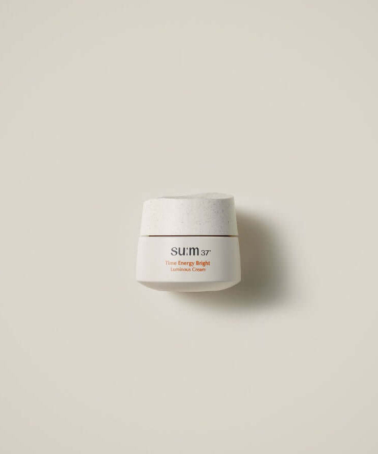 SU:M37 Time Energy Bright Luminous Cream 50ml in an elegant white jar against a neutral background.