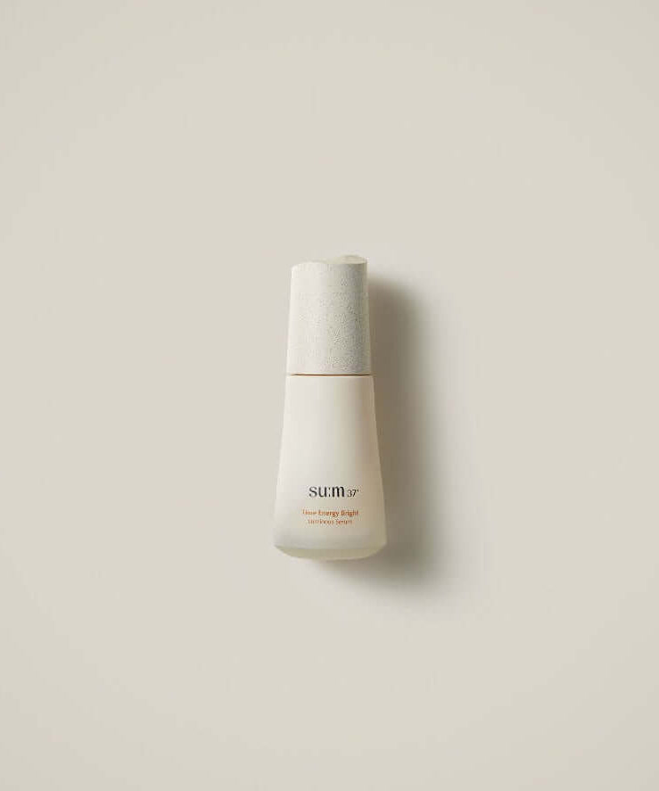 Image of SU:M37 Time Energy Bright Luminous Serum 50ml bottle on a neutral background.