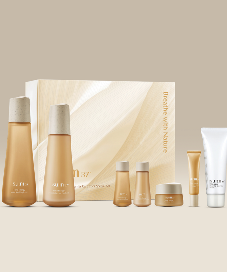 SU:M37 Time Energy Moist Soothing Barrier Care 2-piece set with bottles and tubes against beige background.