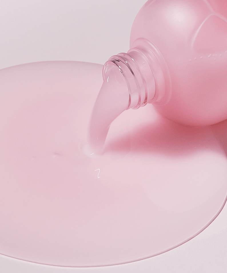 Pouring pink liquid of SUNGBOON EDITOR Apple Peel Glow Skin Soothing Toner 340ml