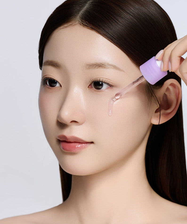 Woman applying SUNGBOON EDITOR Grape Vita C Dark Spot Whitening Ampoule 40ml to skin