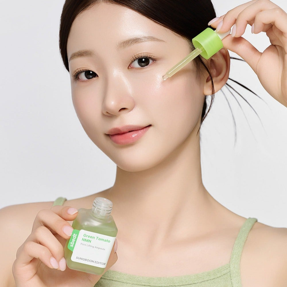 SUNGBOON EDITOR Green Tomato NMN Pore Lifting Ampoule 40ml being applied by a model using a dropper.