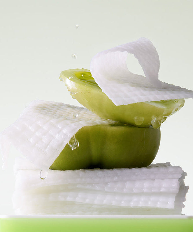 SUNGBOON EDITOR Green Tomato NMN Pore Peeling Jumbo Pad 60 Pads with green tomato and texture in focus.