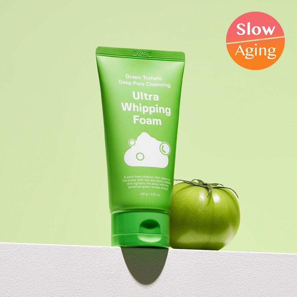 SUNGBOON EDITOR Green Tomato Pore Whipping Foam 120g with green packaging next to a fresh green tomato, highlighting "Slow Aging" benefits.