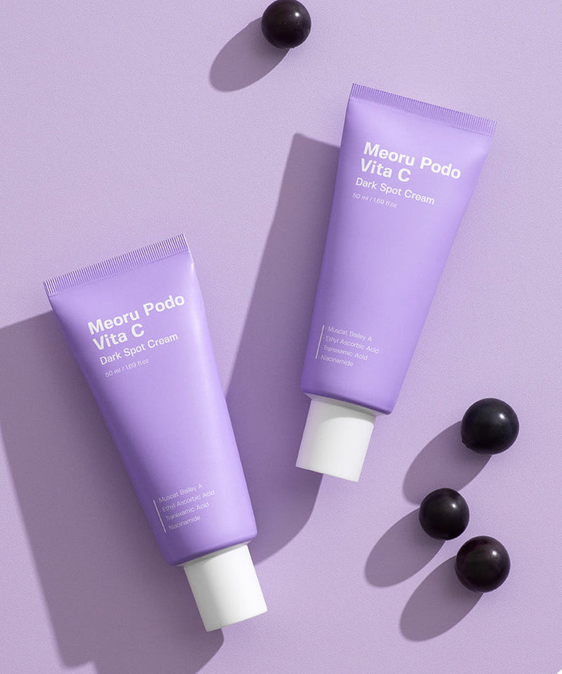SUNGBOON EDITOR Meoru Podo Vita C Dark Spot Cream 50ml tubes on purple background with grapes