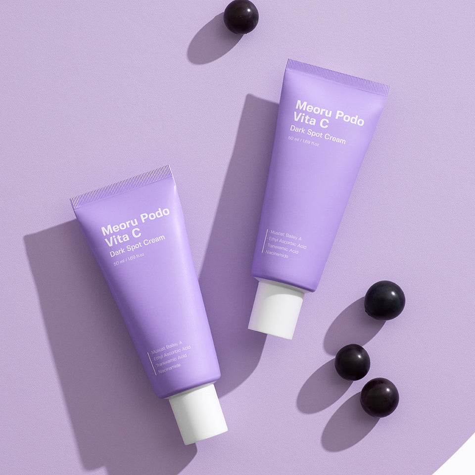 SUNGBOON EDITOR Meoru Podo Vita C Dark Spot Cream 50ml tubes on purple background with grapes