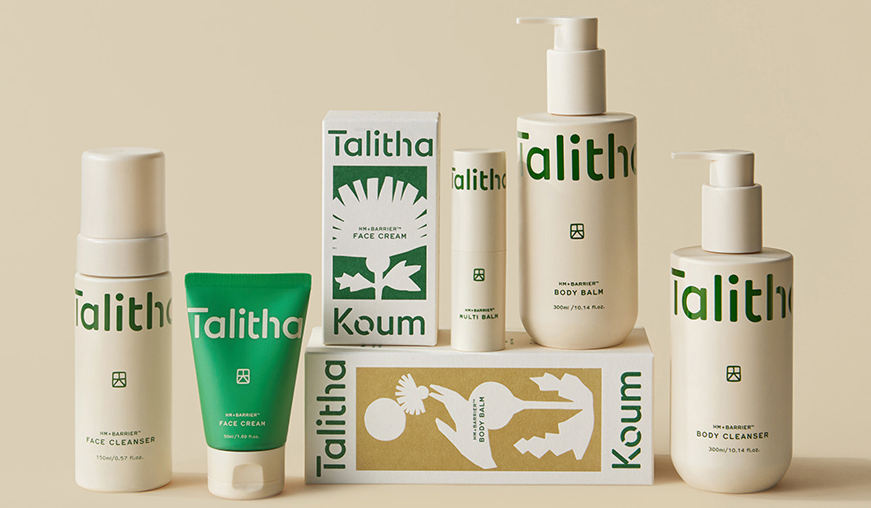 Display of Talitha skincare products including face cleanser, cream, and body balm in minimalistic packaging on a beige background.