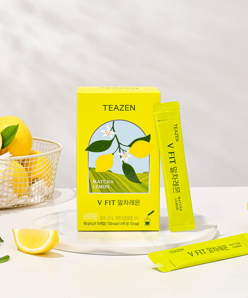 TEAZEN V-Fit Matcha Lemon 10 Sticks packaging with fresh lemons on a table.