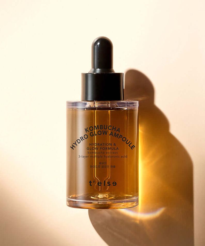 T'ELSE Kombucha Hydro Glow Ampoule 30ml product bottle against a warm background promoting skin hydration and radiance.
