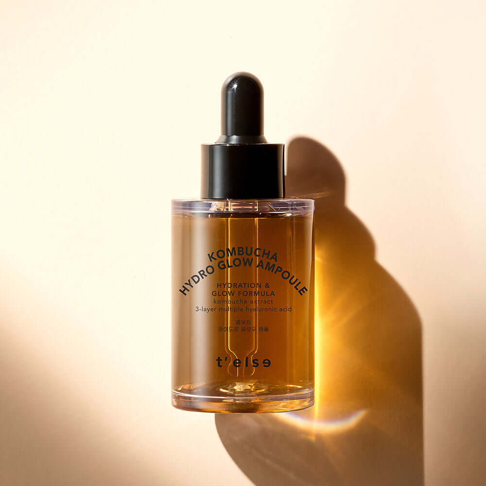 T'ELSE Kombucha Hydro Glow Ampoule 30ml product bottle against a warm background promoting skin hydration and radiance.